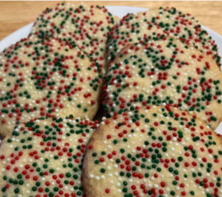 close up of a plate of sprinkle butter cookies